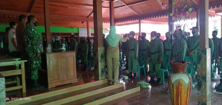  Anggota Satgas, Linmas dan Satpol PP Nyanyikan Lagu Indonesia Raya Dilokasi TMMD Bojonegoro